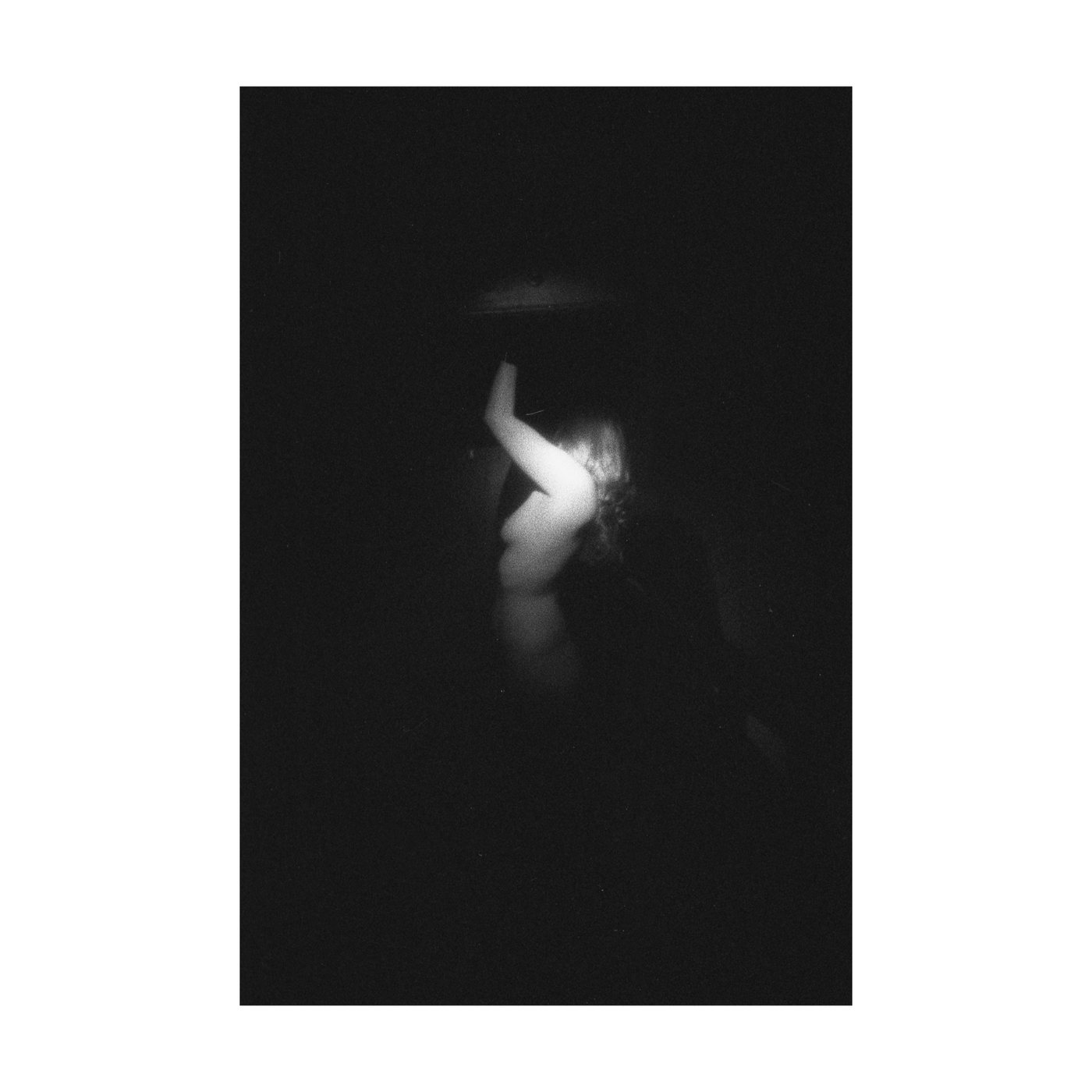 Rhythm of the Heat 01, a dark photograph of a partially lit body in shadow.