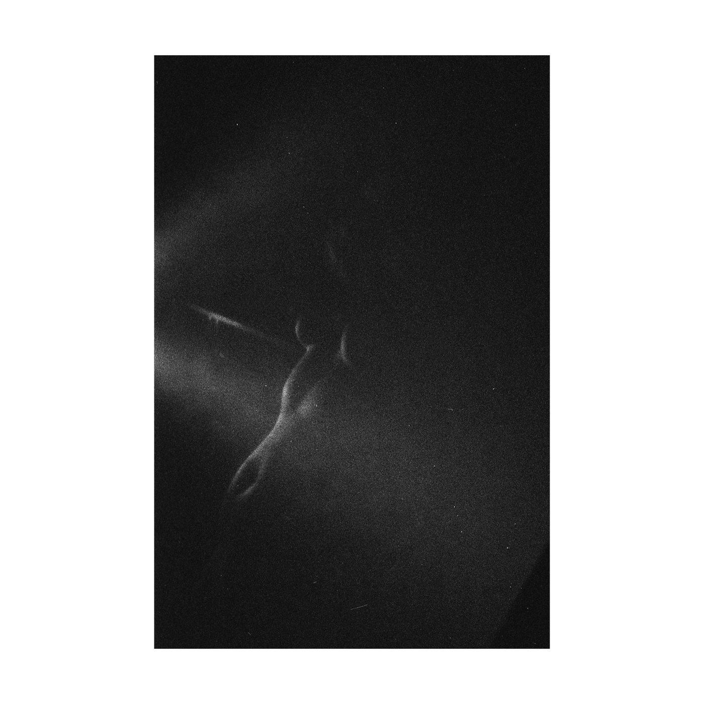 Rhythm of the Heat 05, a dark photograph of a body touched by a beam of light.